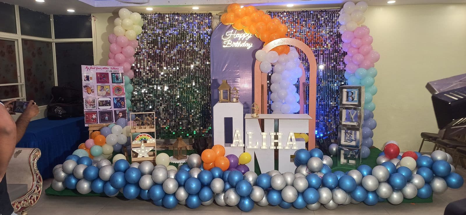 First birthday setup with ONE letters and blue balloon floor