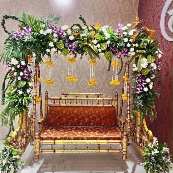 Floral jhoola swing with orchids and marigold strands