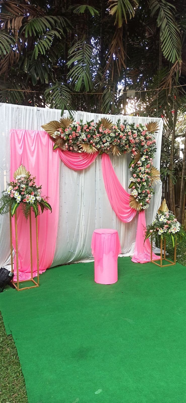 Pink drape garden backdrop with floral corners