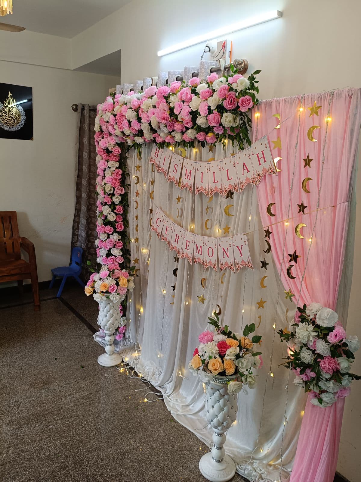 Pink floral backdrop with moon and star details