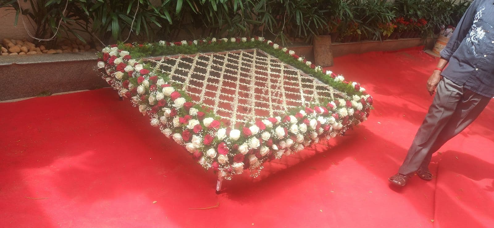 Angled view of a red and white rose phoolon ki chadar