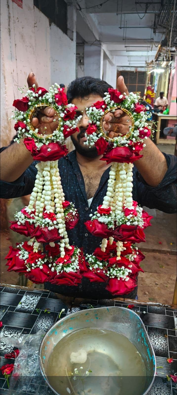Red and white rose varmala garlands made by hand for a wedding
