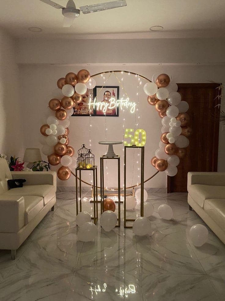 Rose gold and white balloon ring with photo frame for a home birthday celebration