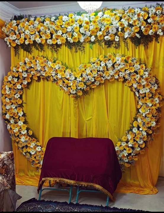 Heart-shaped gerbera daisy backdrop for a home birthday celebration