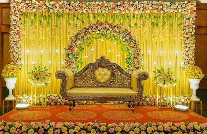 Rose and peach floral arch reception stage with paper crane details