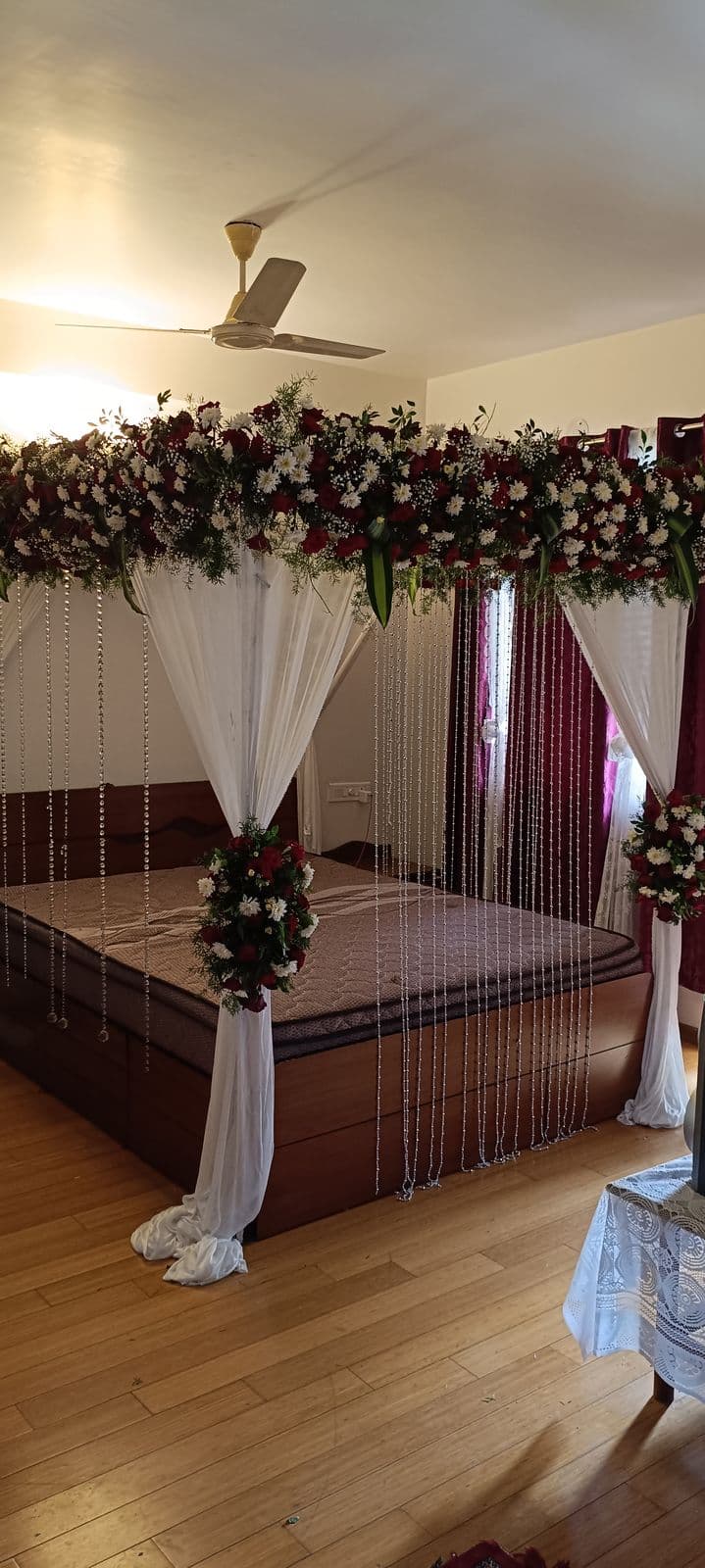 Rose bed canopy with white drapes