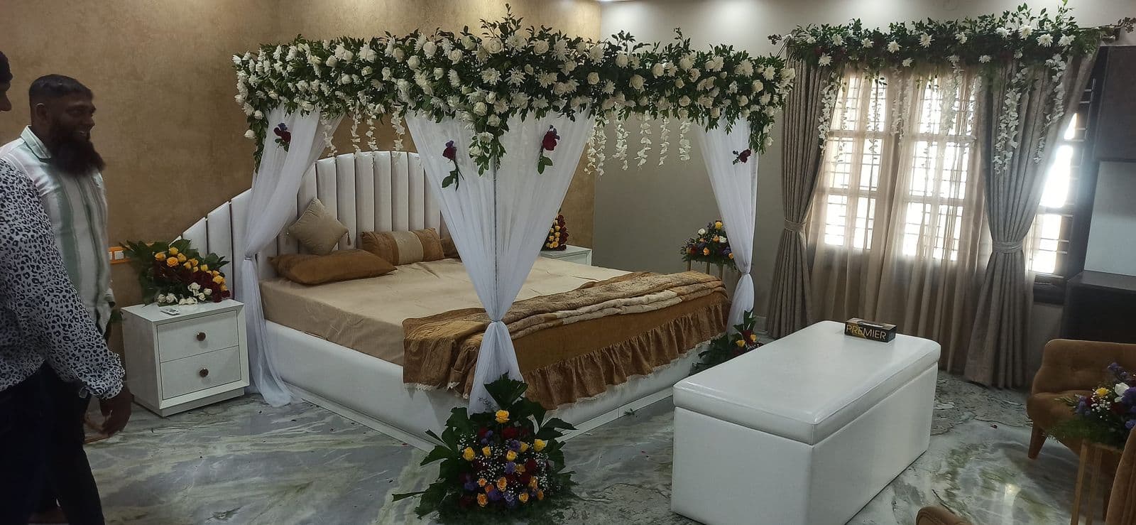 Bedroom decoration with white drapes and rose canopy